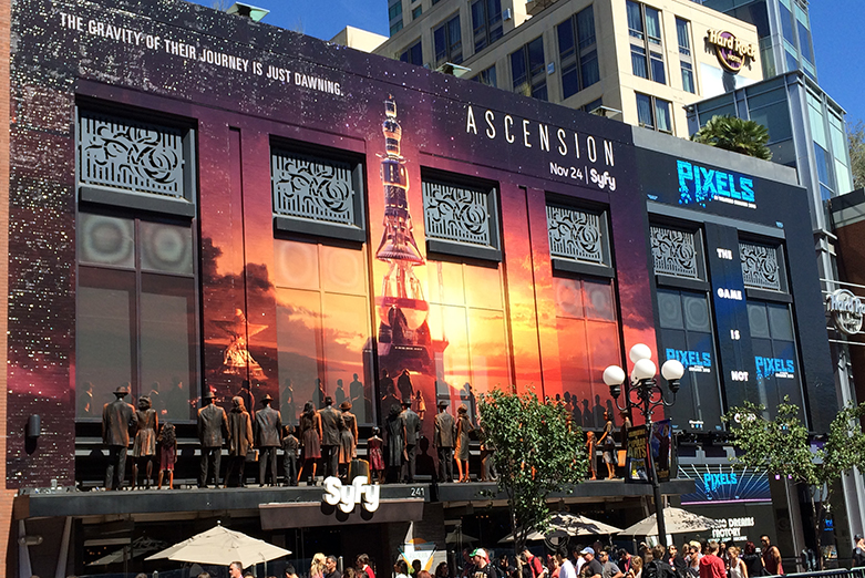 Ascension advertisement, side of building, San Diego: the dummies of people are wearing clothes that rustle in the wind.